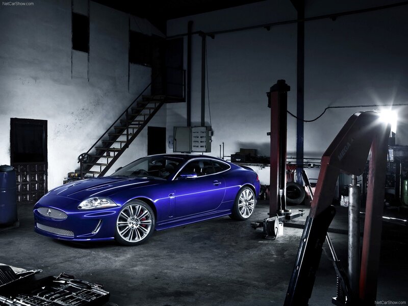 Blue Jaguar Coupe — Dramatic, Photograph, Car Lift