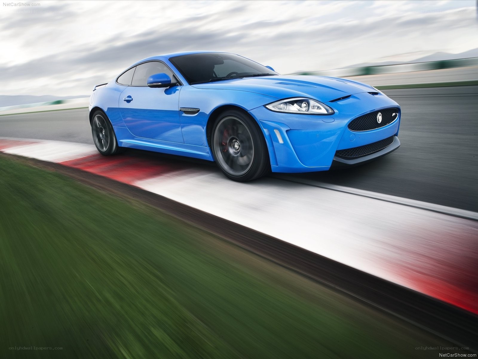 Blue Jaguar F-Type on racetrack