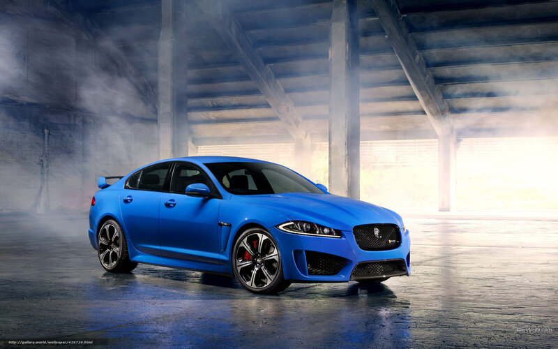 blue jaguar in a smoky garage