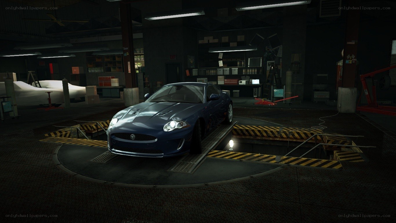 blue jaguar in garage
