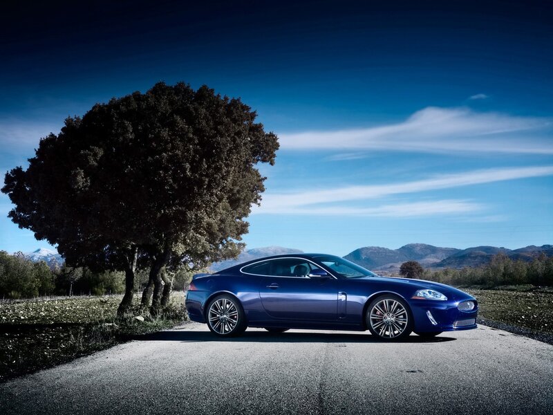 Blue Jaguar on a country road