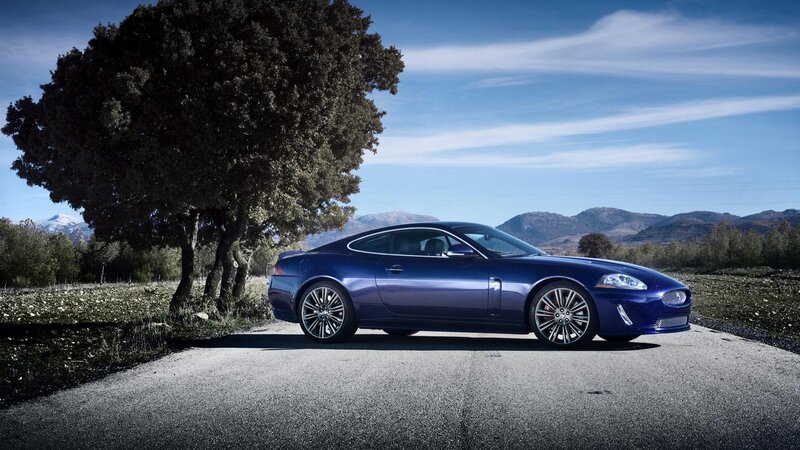 Blue Jaguar on a country road
