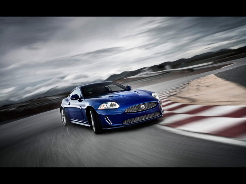 Blue Jaguar on a racetrack