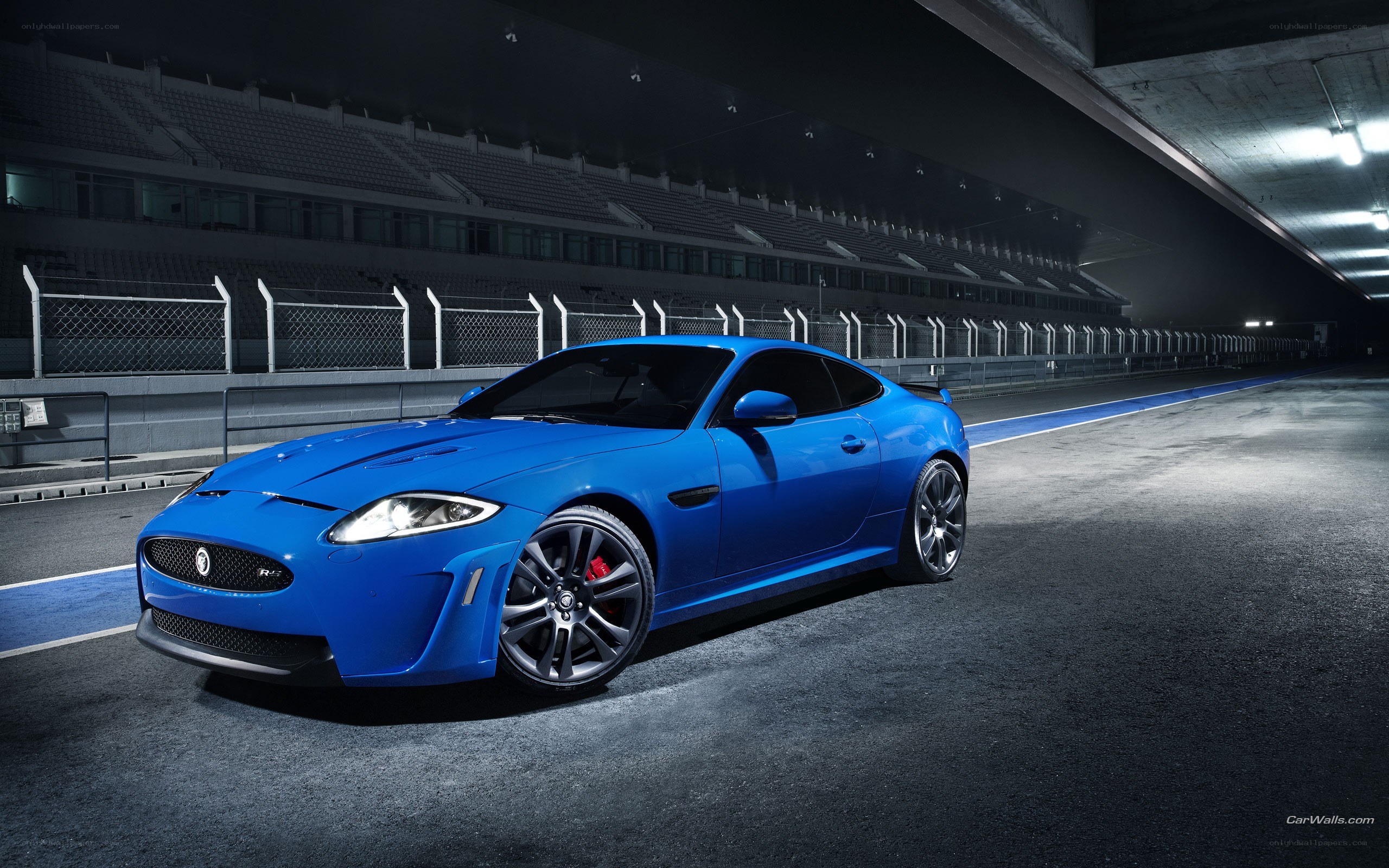 Blue Jaguar on a racetrack