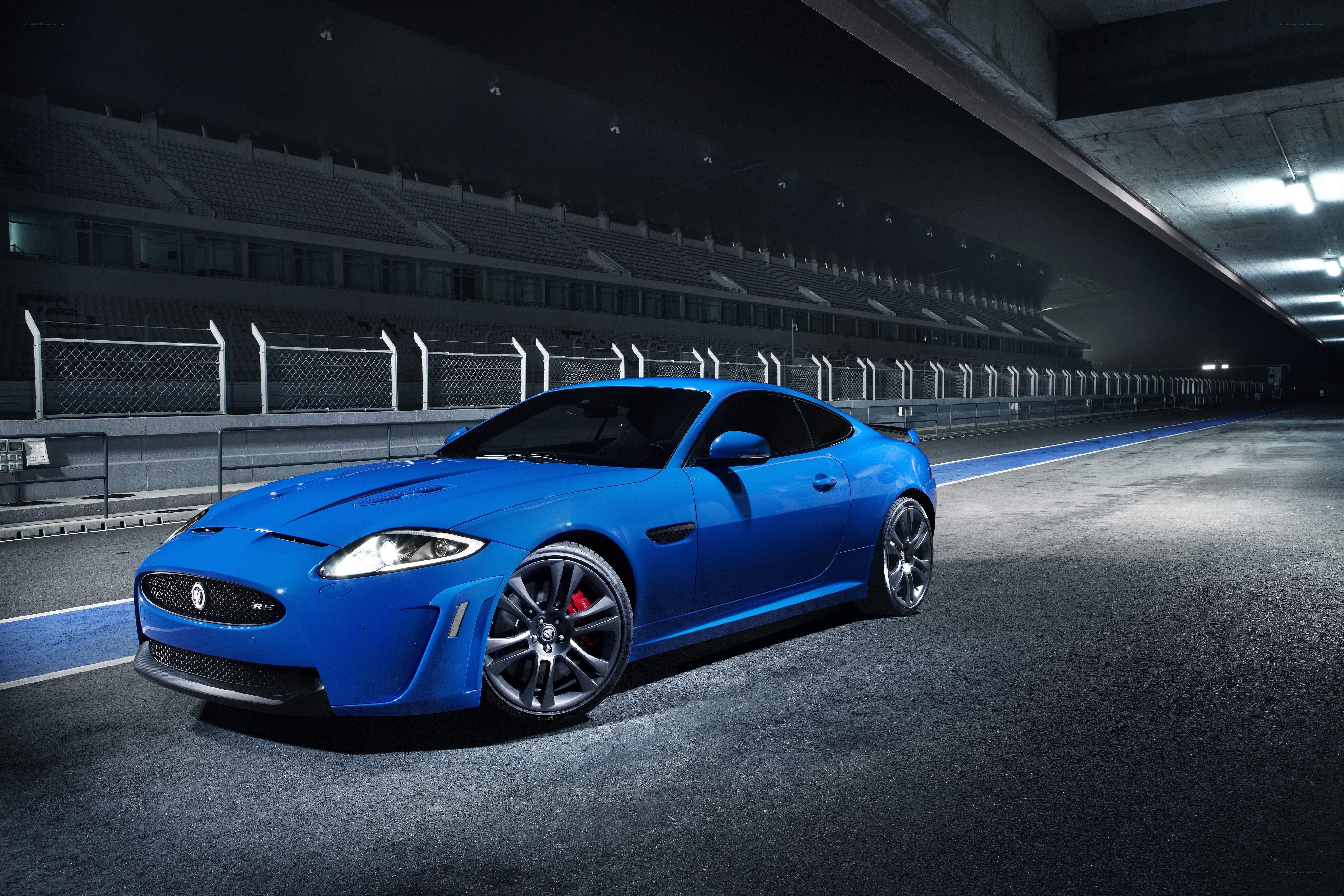 Blue Jaguar on a racetrack