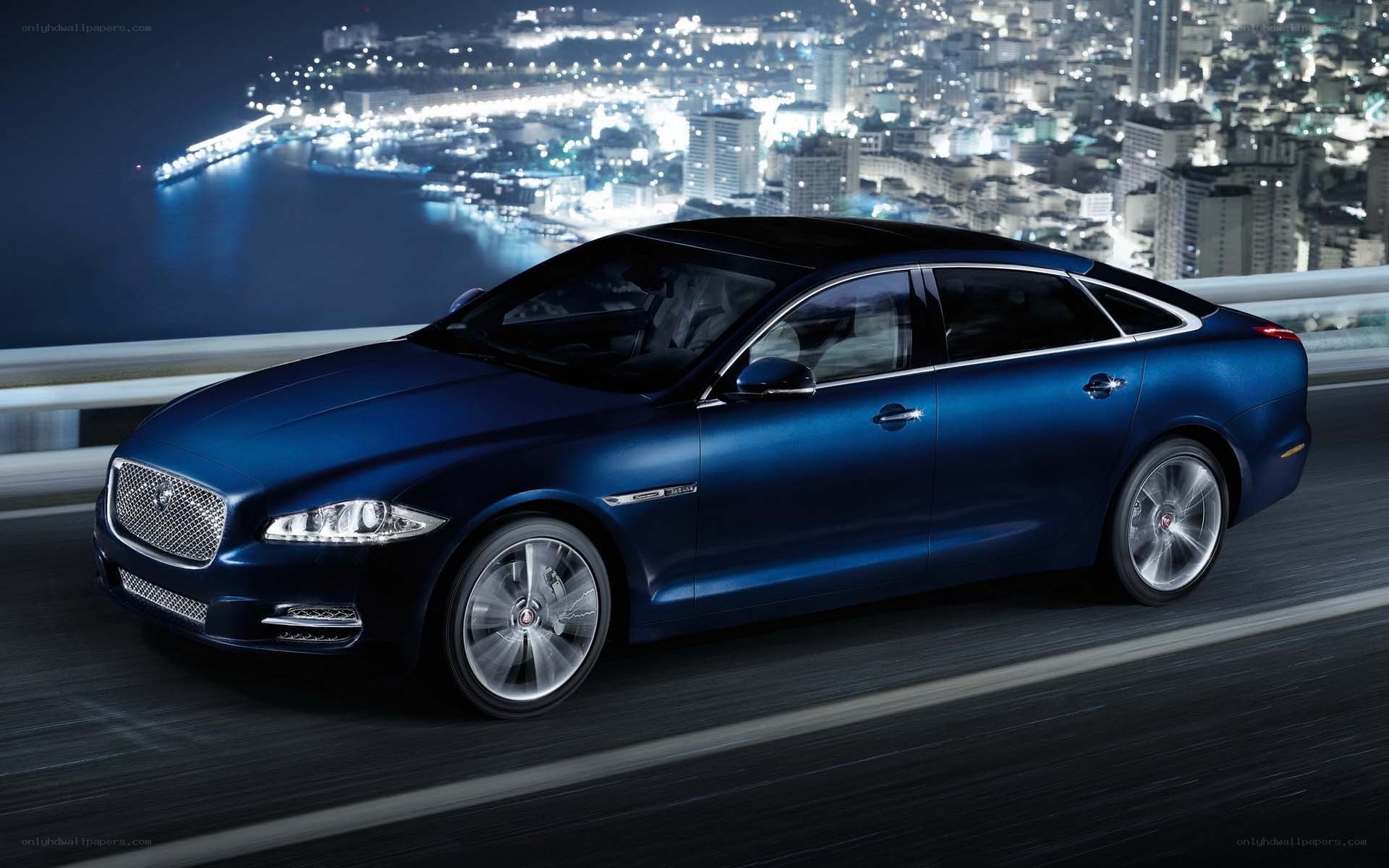 blue jaguar on city bridge