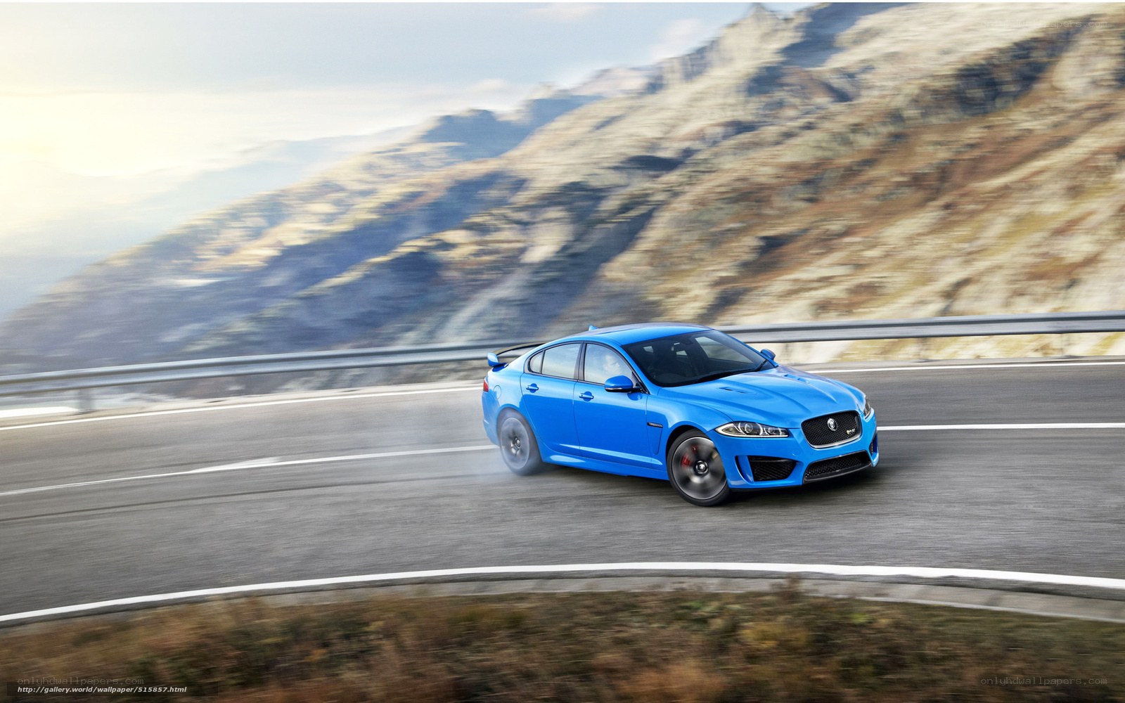 Blue Jaguar on mountain road