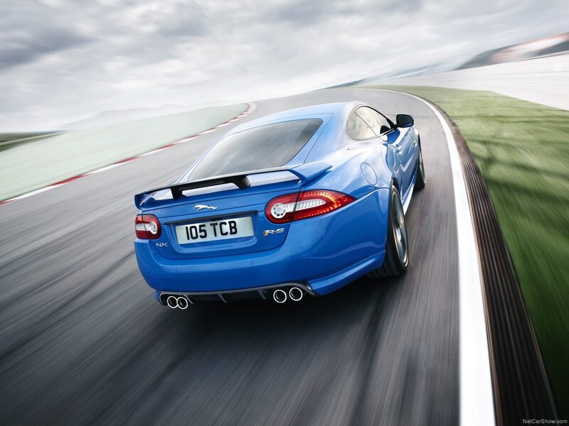 blue jaguar r-s on racetrack