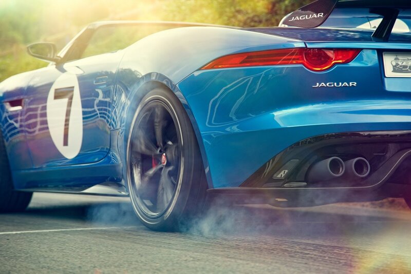 Blue Jaguar race car on track