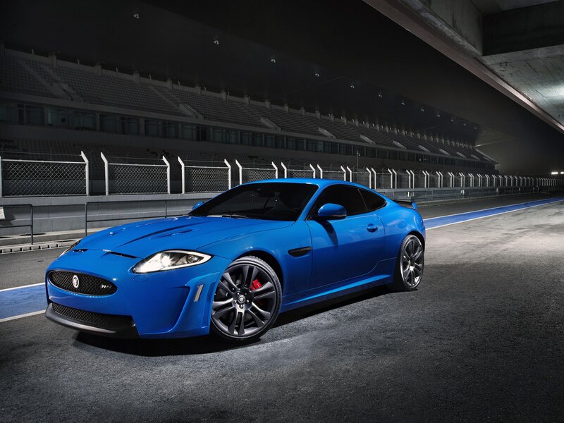 Blue Jaguar Sports Car — Dramatic, Night, Photograph, Race Track, Stadium Seats