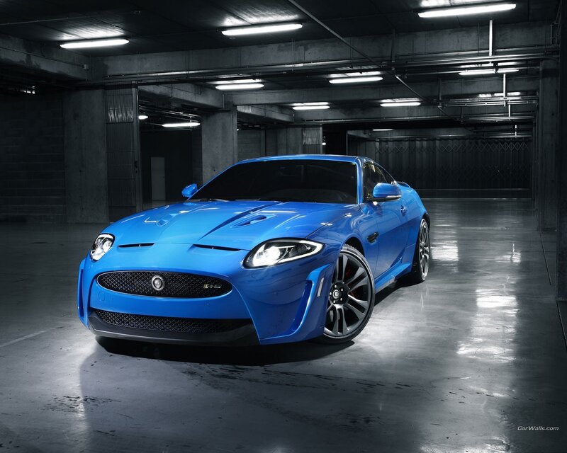 Blue Jaguar sports car in garage