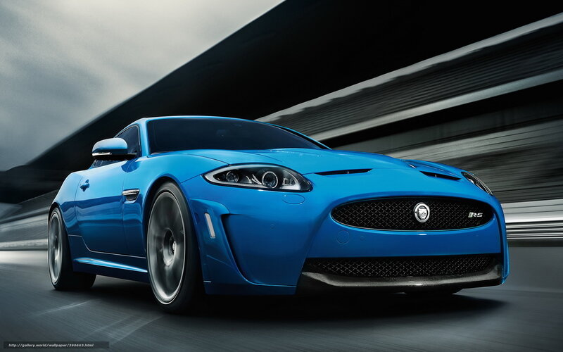 Blue Jaguar sports car in motion