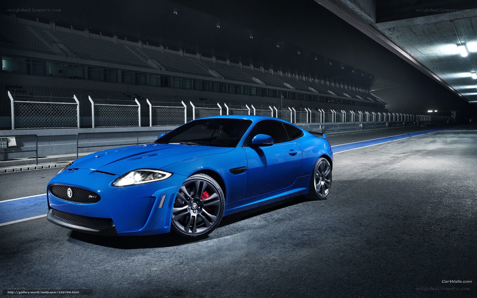 Blue Jaguar sports car on racetrack
