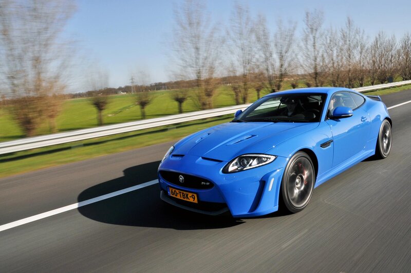 Blue Jaguar sports car on road