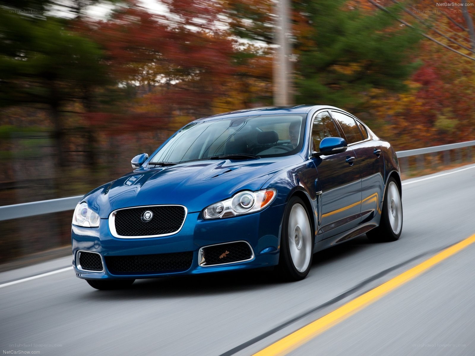 blue jaguar xf in motion