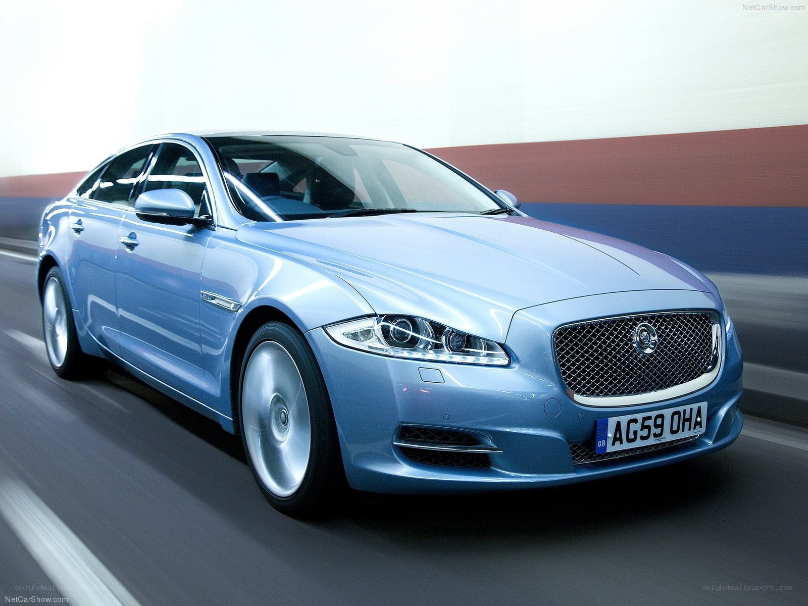 blue jaguar xj in motion