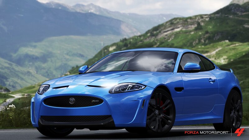 Blue Jaguar XKR-S on mountain road