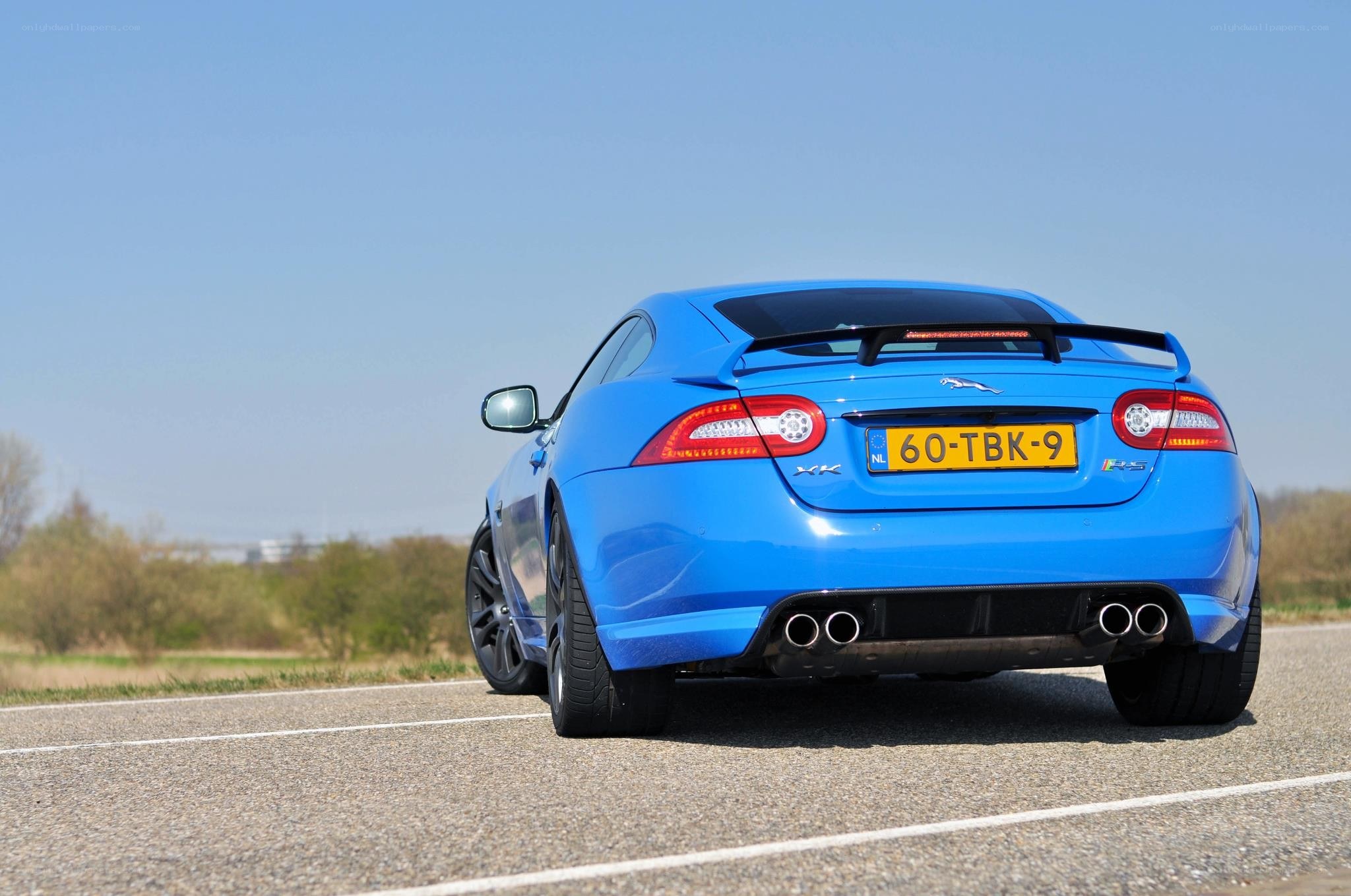 blue jaguar xkrs on road