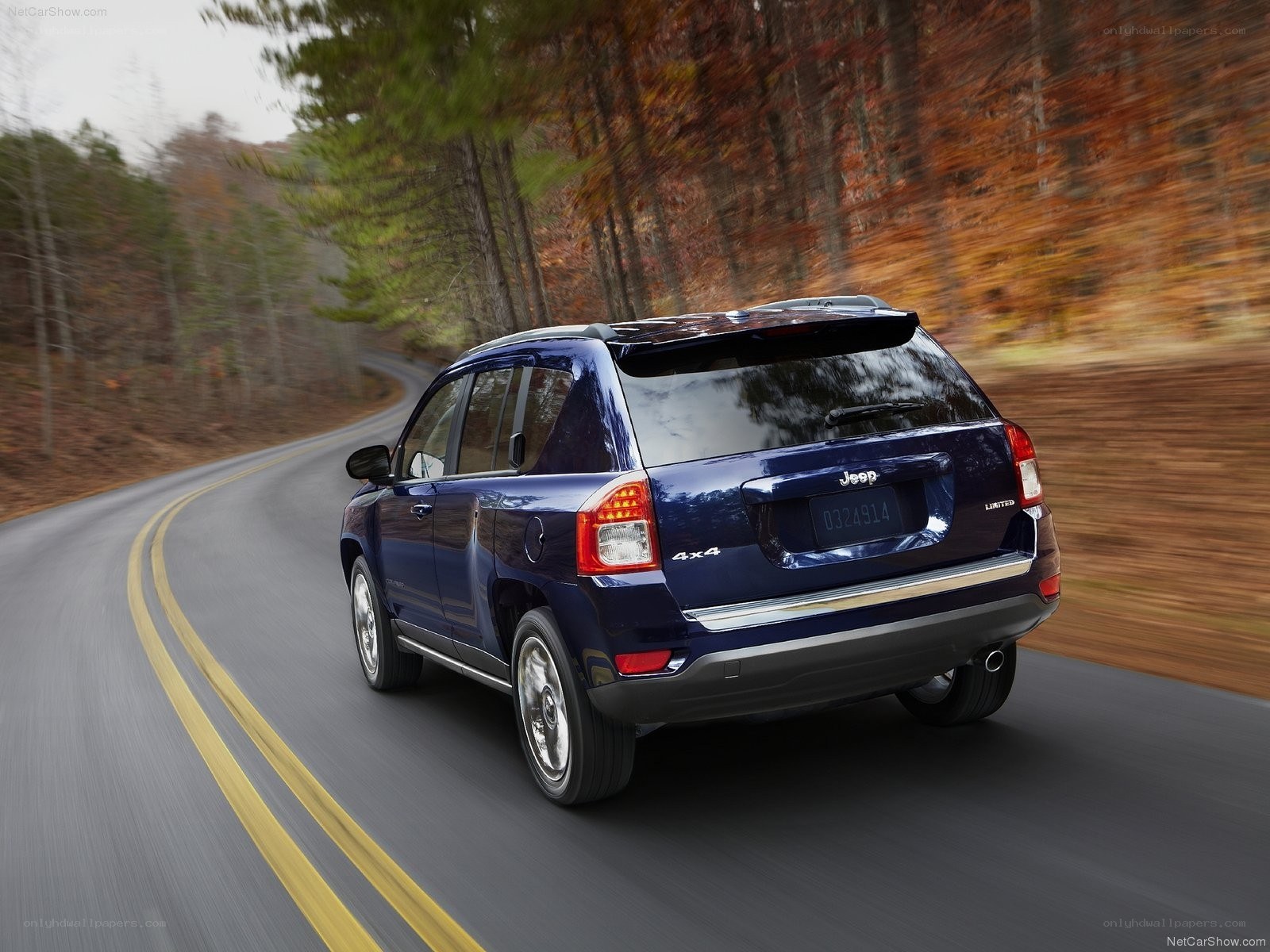 Blue Jeep Compass on a forest road