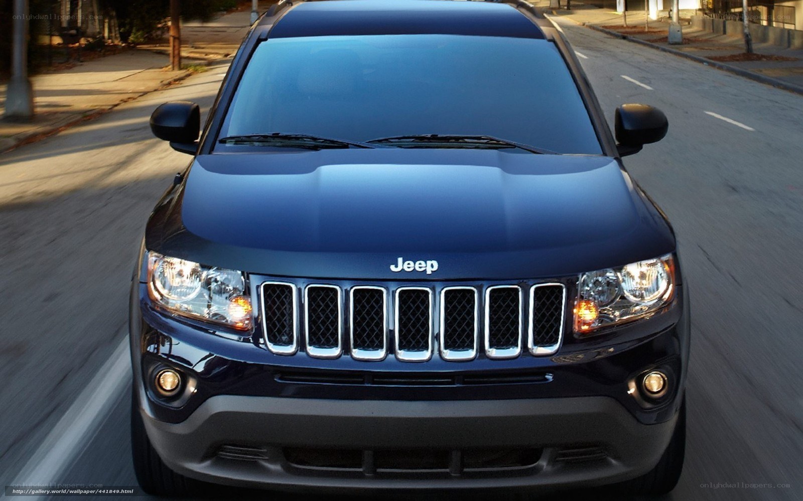 Blue Jeep Compass on city street