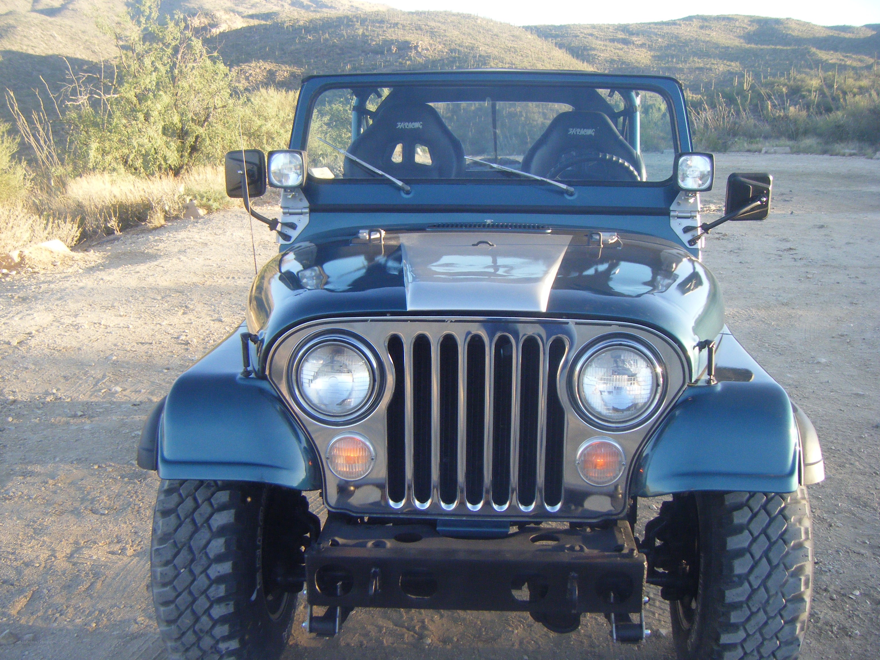 Blue Jeep in Desert Landscape