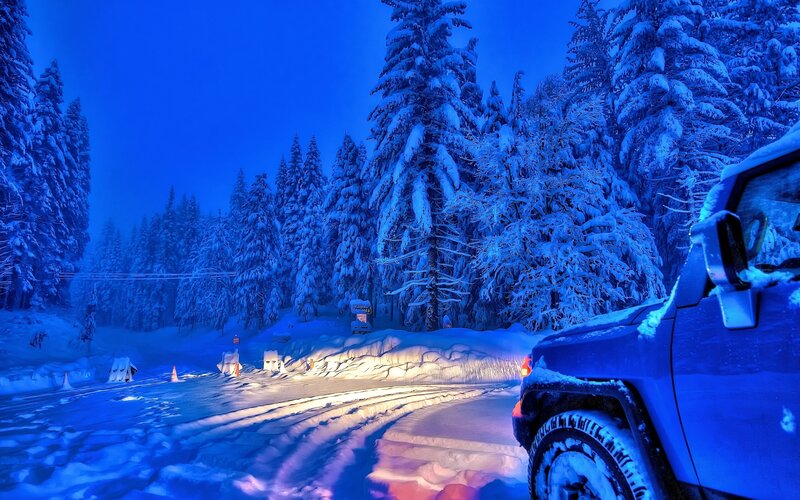 Blue Jeep in Snow