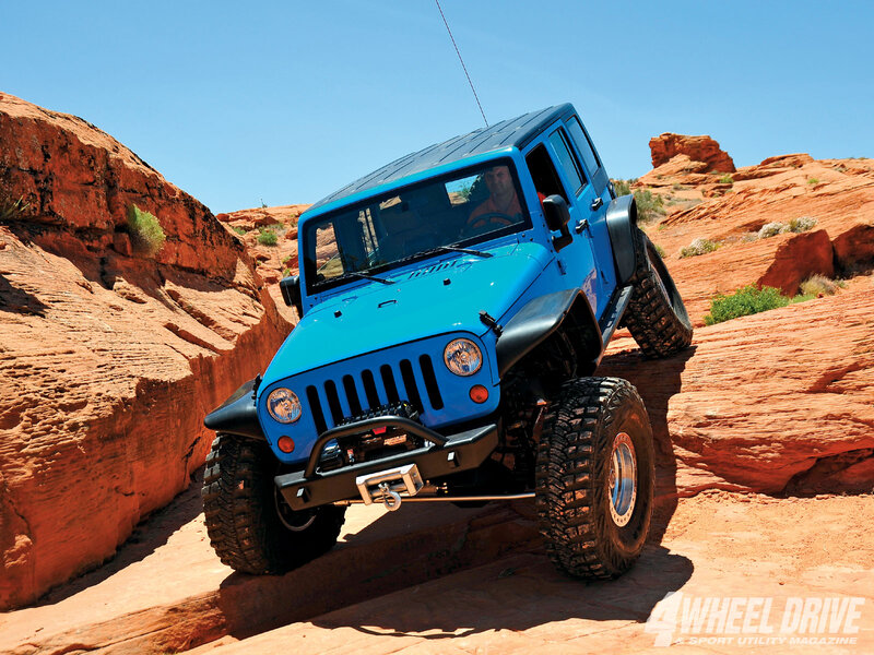 Blue Jeep off-roading