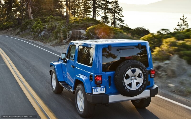Blue Jeep on a scenic road