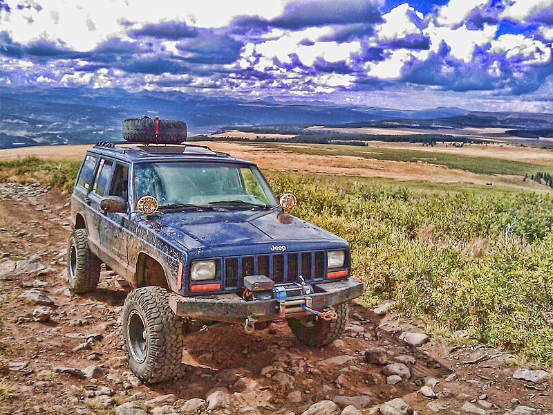 Blue Jeep on Dirt Path