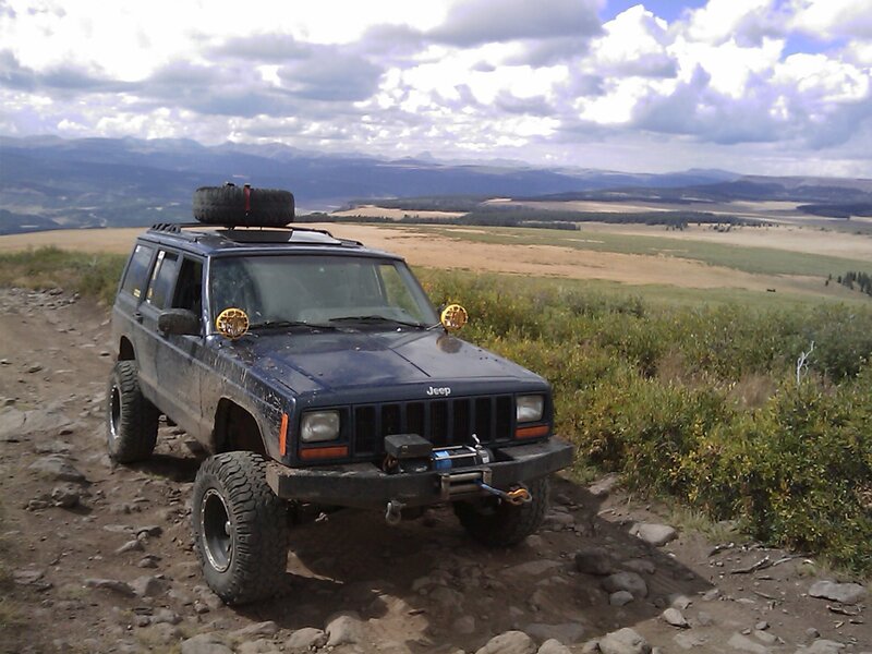 Blue Jeep on Dirt Road