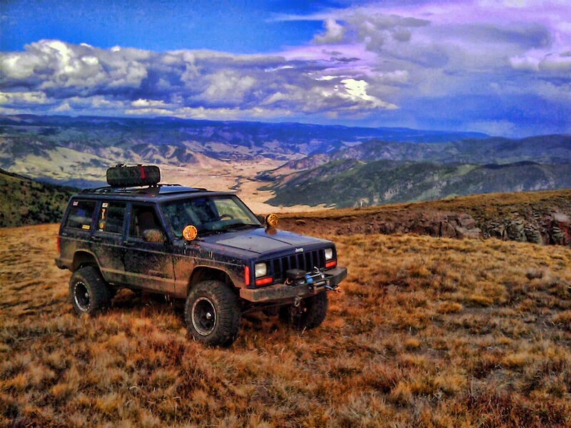 Blue Jeep on Hillside