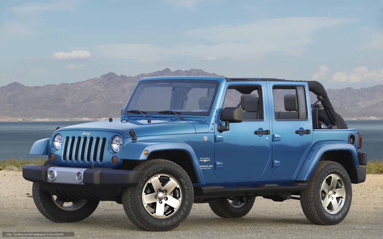 Blue Jeep Wrangler by water