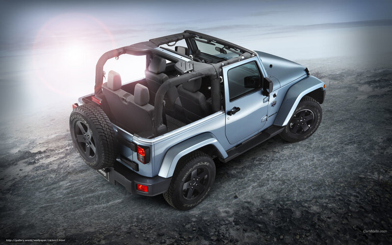 blue jeep wrangler on rocky terrain