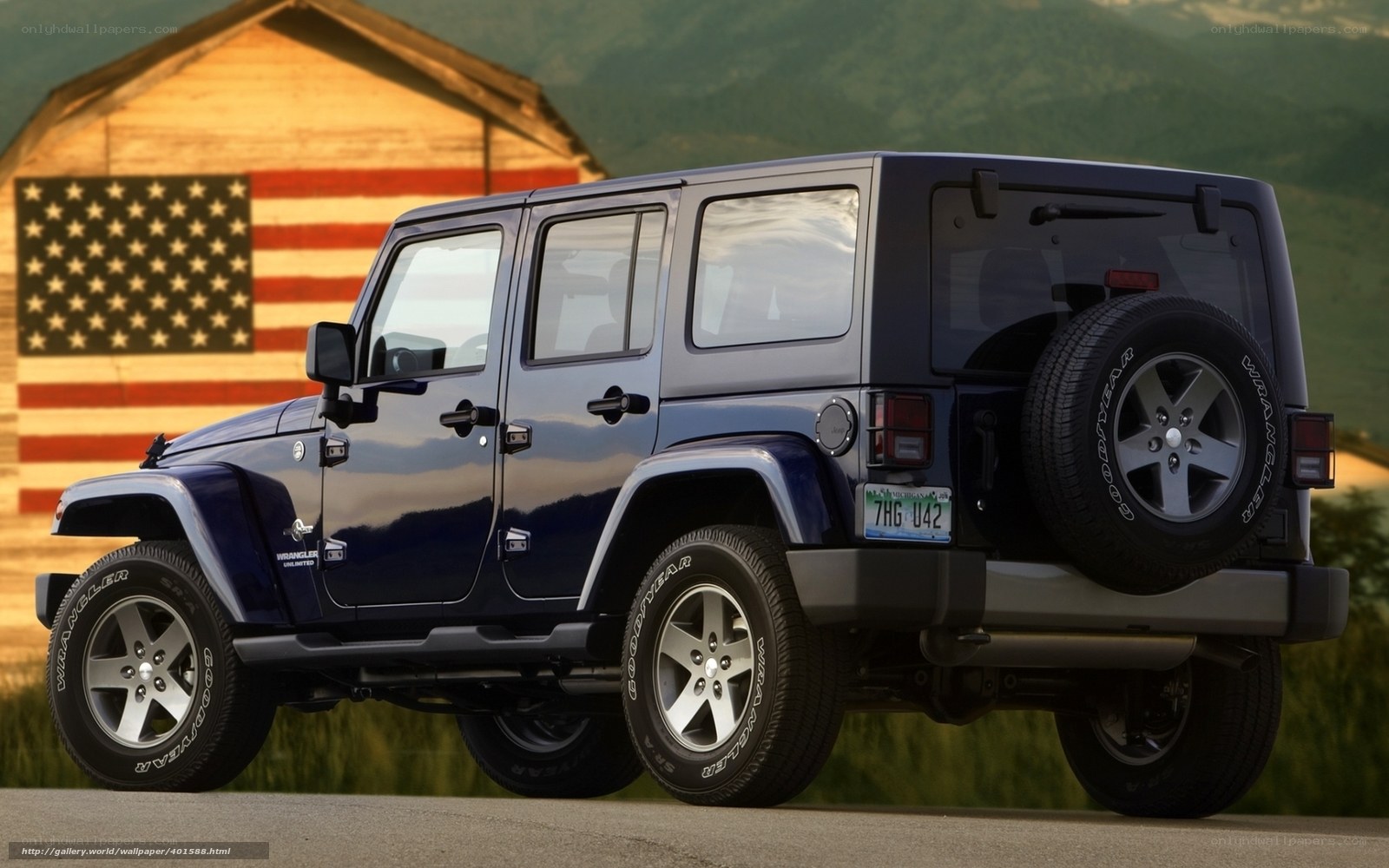 Blue Jeep Wrangler with American flag