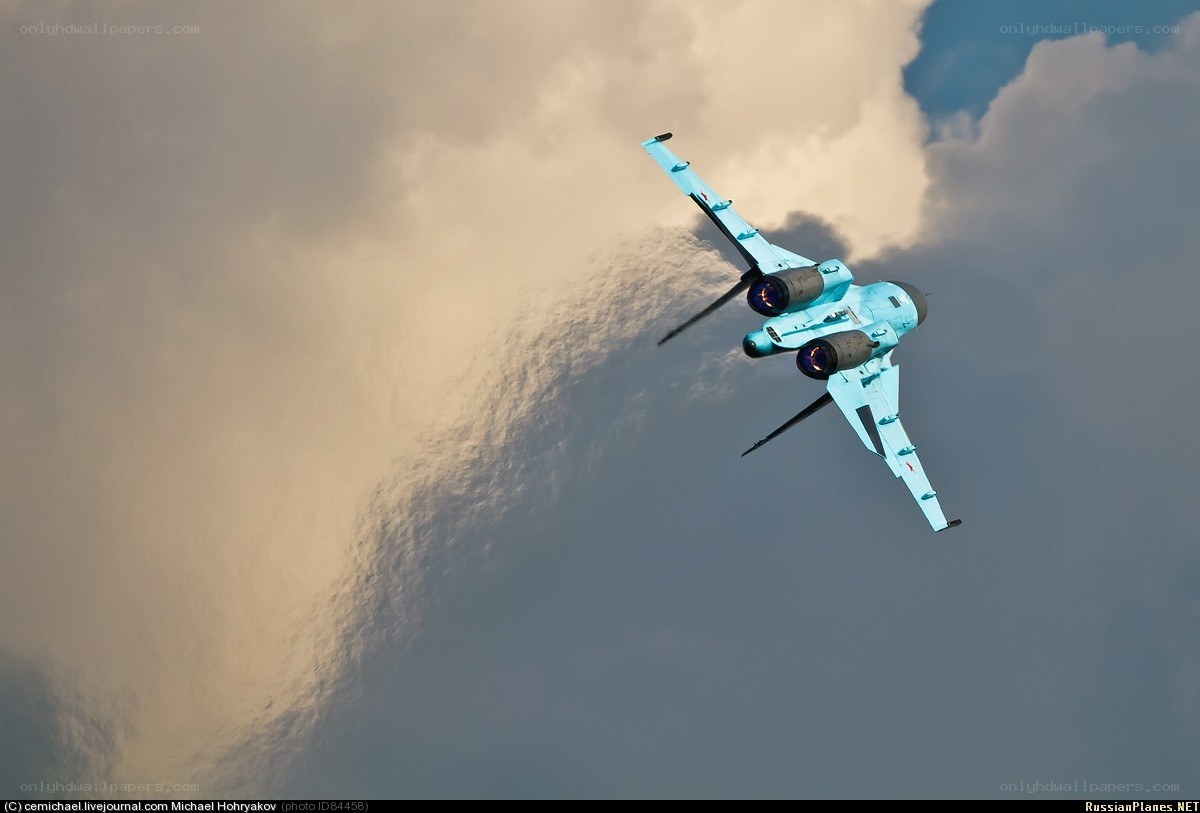 Blue jet in cloudy sky