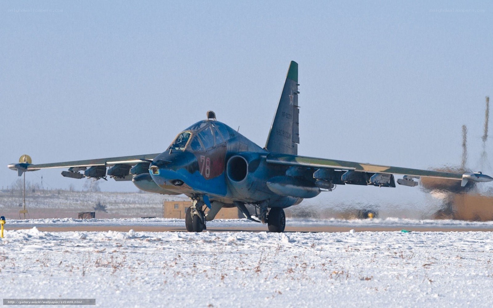 Blue jet on snowy runway