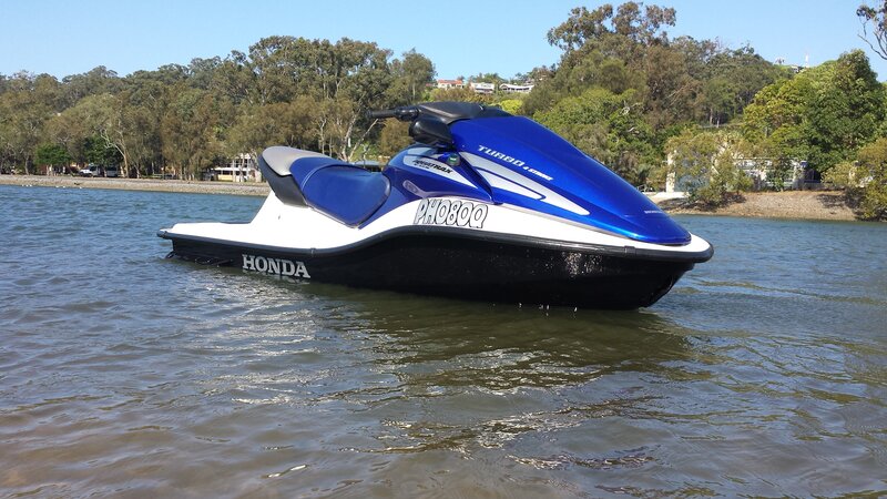 Blue Jet Ski in Water — Calm, Afternoon