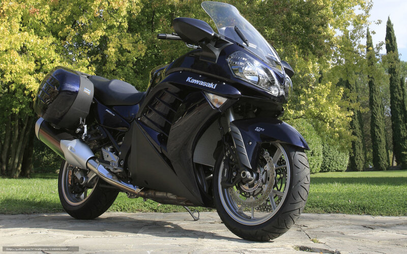 Blue Kawasaki motorcycle in park
