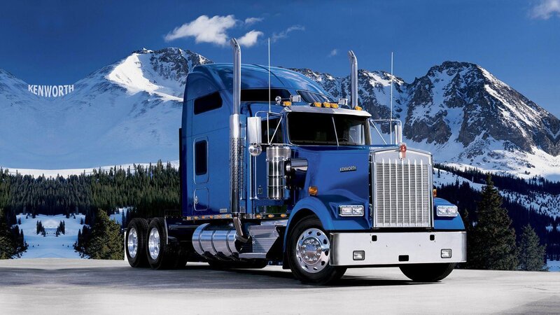 Blue Kenworth truck in mountains