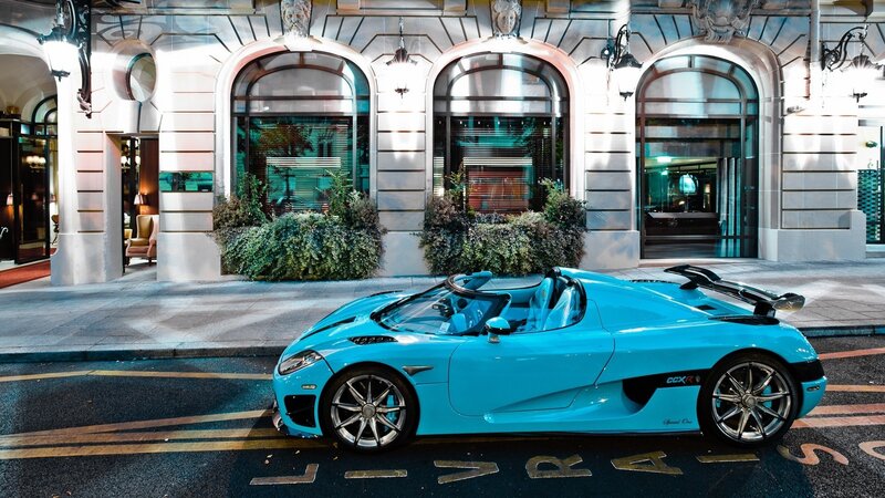 Blue Koenigsegg CCXR parked on street