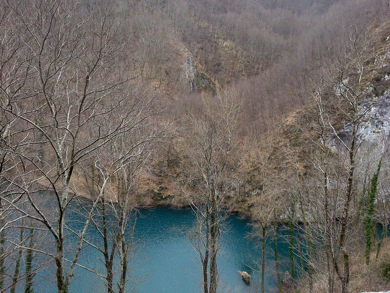 Blue lake in a forested valley