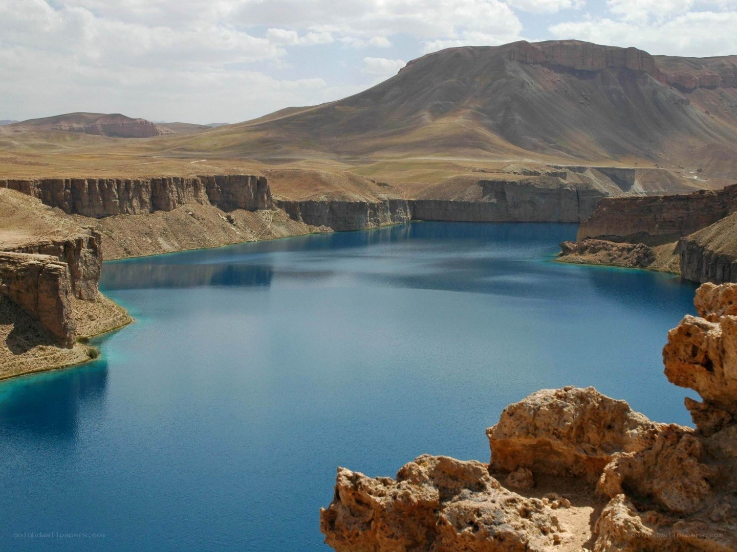 Blue lake in arid canyon