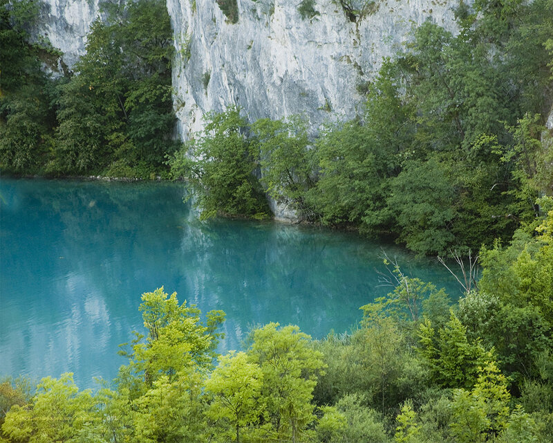 Blue lake in forested canyon