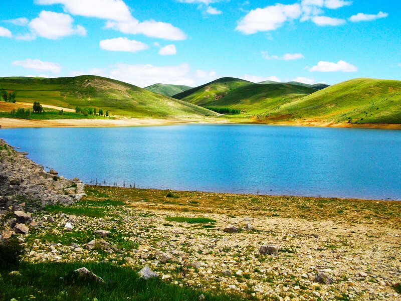 Blue lake in green hills