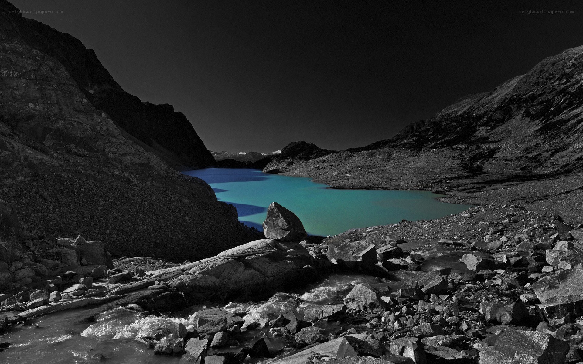 Blue lake in rocky valley