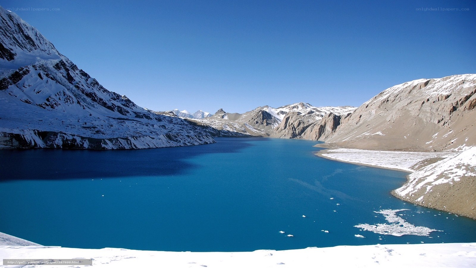 Blue lake in snowy mountains