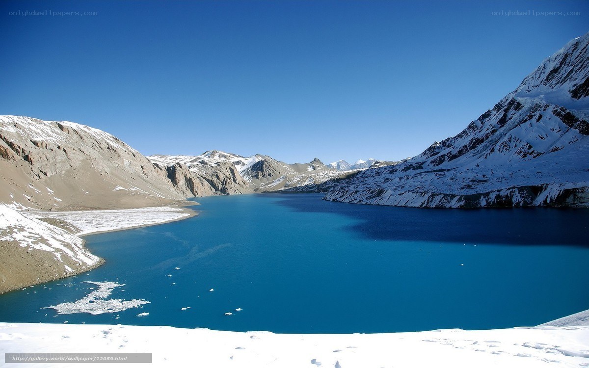 Blue lake in snowy mountains