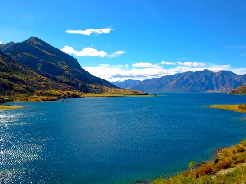 Blue lake surrounded by mountains