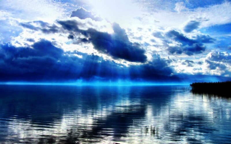 Blue Lake under Cloudy Sky — Dramatic