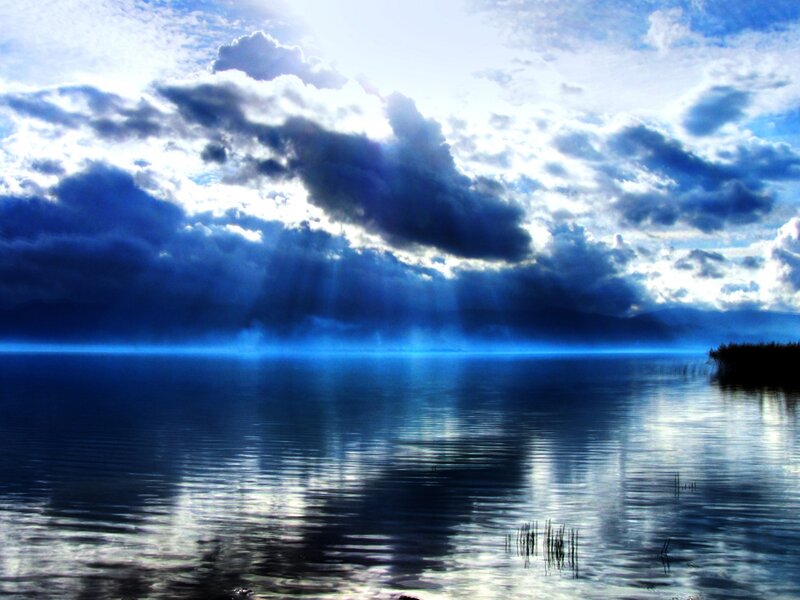 Blue Lake under Stormy Sky